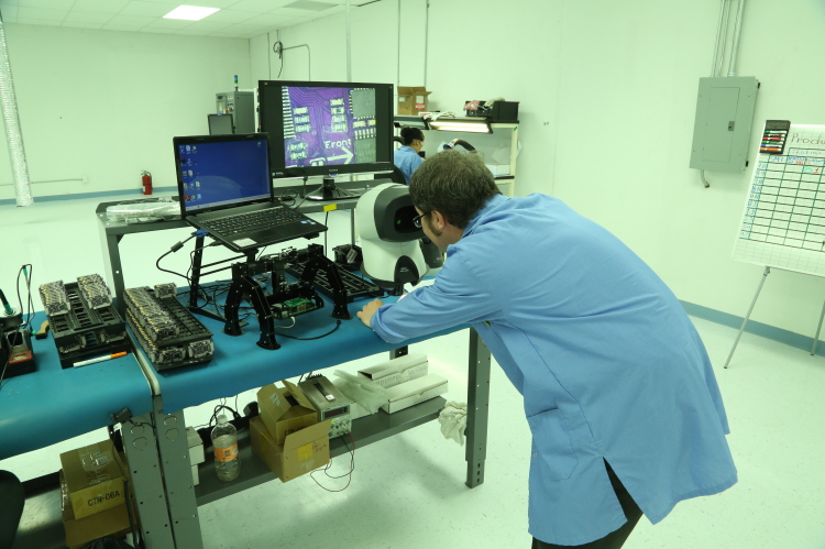 A technician checks a printed circuit board in the 3DR manufacturing plant in Tijuana - Source