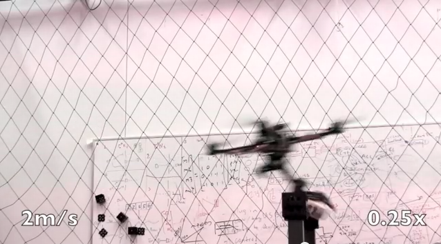 Upenn robot quadcopter in the act of grasping a target object