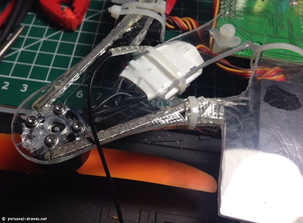 One arm of the quadcopter with two metal sticks glued in place